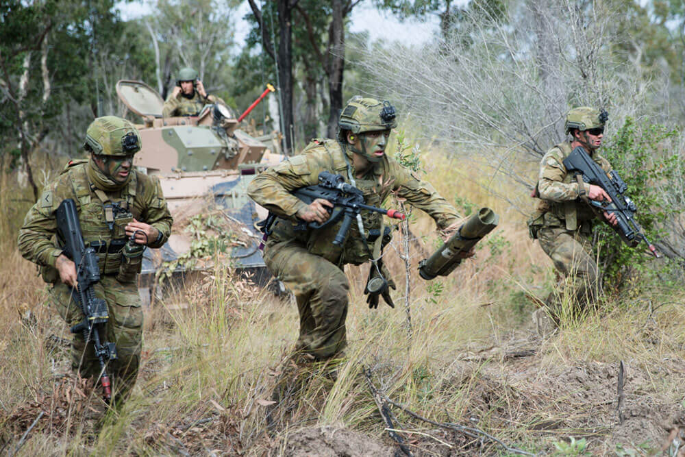 Australian Defence Force soldiers from Battlegroup War Horse take part in a notional assault on Williamson Airfield in the Shoalwater Bay Training Area, as part of Exercise Hamel, June 2018. Australian Defence Force photo by Capt. Roger Brennan