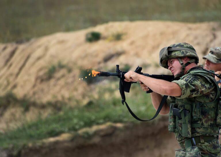 A member of the Serbian Armed Forces completes a training maneuver using a U.S. military M26 Modular Accessory Shotgun during the non-lethal weapons training portion of Exercise Platinum Wolf 2018.