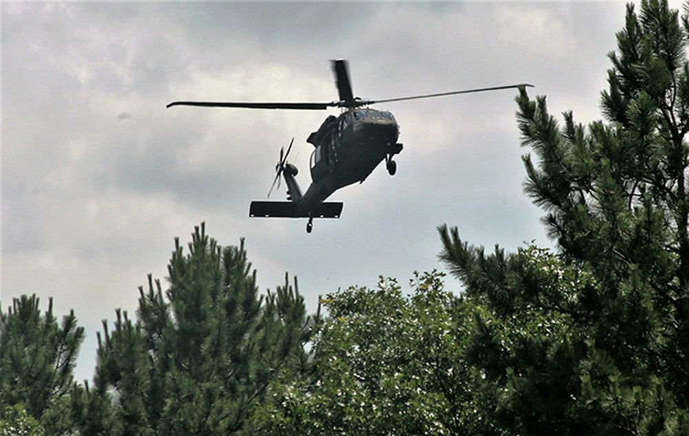 A UH-60 Black Hawk helicopter operated by a crew with the Wisconsin Army National Guard flies over the Combined Arms Collective Training Facility as part of Exercise Audacious Warrior 2018, an explosive ordnance disposal training held June 2018 at Fort McCoy, Wis. U.S. Army photo by Scott T. Sturkol