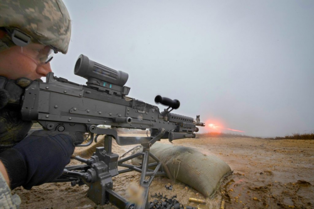 CPL Brandon Chadwick, 44th Infantry Brigade Combat Team, A Company, 1-114th Infantry Regiment, New Jersey Army National Guard, fires a M240 machine gun during weapons training on Joint Base McGuire-Dix-Lakehurst, N.J., in November of 2018. New Jersey National Guard photo by MSgt Matt Hecht