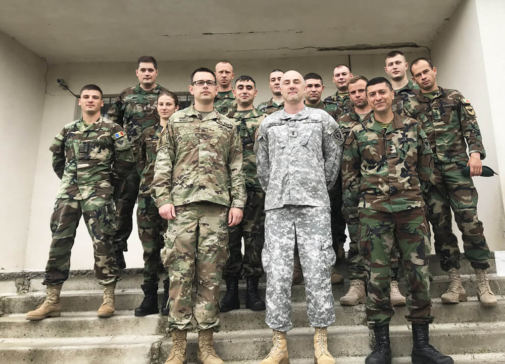 FRONT ROW, FROM LEFT: SGT Jacob Voss and CW4 Donald Champion,, both of the North Carolina National Guard’s Joint Force Headquarters, stand with soldiers of the Moldovan Armed Forces who participated in a cyber defense course taught by CW4 Champion and SGT Voss as part of the National Guard’s State Partnership Program.