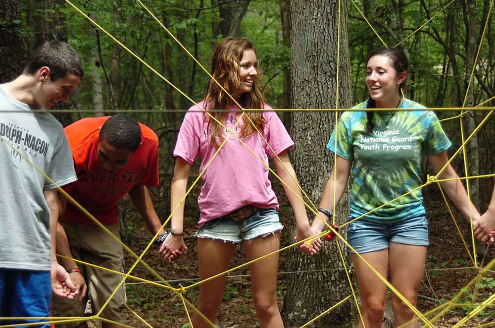 Teen campers at the Virginia National Guard Teen Wilderness Adventure Camp participate in a team-building exercise at Eagle Landing in New Castle, Va. The Virginia National Guard Youth Program partnered with Operation Military Kids to provide 60 Virginia National Guard youth four days of outdoor adventures including mountain biking, kayaking, inner tubing, navigating ropes courses and zip lining. Virginia Army National Guard photo by MSG A.J. Coyne