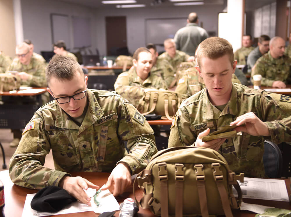 SPC Michael Maycock and SPC Colt Parris, fire direction operators assigned to the Wyoming Army National Guard’s 2nd Battalion, 300th Field Artillery Regiment, inventory and organize their CLS bags during a 40-hour Combat Lifesaver course at the 213th Regional Training Institute at Camp Guernsey JTC, January 2019.  Wyoming Army National Guard photos by SFC Jimmy McGuire