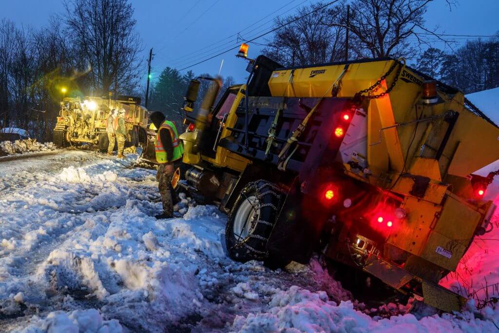 North Carolina Army National Guard Soldiers assigned to the 690th Brigade Support Battalion recover a plow stuck in the snow during Winter Storm Diego, December 2018. As part of the storm response, 175 North Carolina Guard Soldiers were strategically placed across the State to augment emergency management personnel. Winter Storm Diego crippled parts of the Southeast when it dropped 34 inches of snow at its highest point Dec. 8-9, 2018, stranding motorists on highways and leaving more than 400,000 residents without power. North Carolina Army National Guard photo by SGT Joe Roudabush