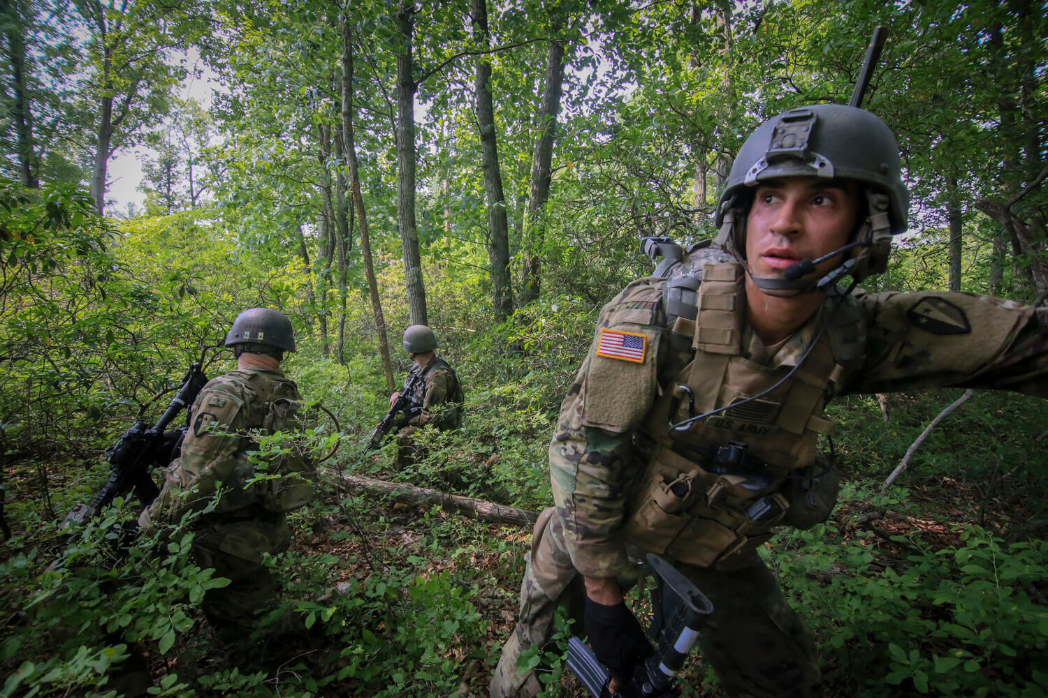 Army National Guard Soldiers from New Jersey’s C Troop, 1st Squadron, 102nd Cavalry Regiment, move tactically through woods en route to an objective as part of a training mission on Joint Base McGuire-Dix-Lakehurst, N.J., June 2018. New Jersey National Guard photo by MSgt Matt Hecht