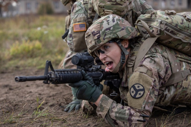 SPC Natalie Lajune, a combat medic with Battle Group Poland’s Task Force Raider, directs her firing squad toward their next maneuver during a care under fire training exercise at Bemowo Piskie Training Area, Poland, October 2018. Task Force Raider is a detached forward element assigned with the Tennessee Army National Guard’s 278th Armored Cavalry Regiment, headquartered out of Knoxville, Tenn. Tennessee Army National Guard photo by SGT Sarah Kirby