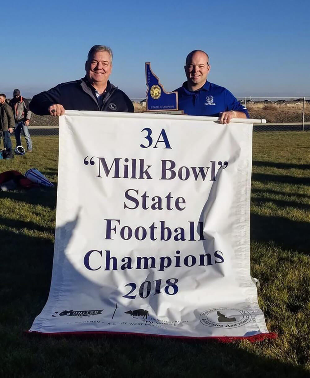 Idaho Army National Guard Soldier SSG Tyler Richins (right) alongside his father, Dwight Richins, after coaching Sugar-Salem High School to the Idaho 3A state football championship Nov. 17, 2018. Idaho Army National Guard photo by CPT Robert Taylor