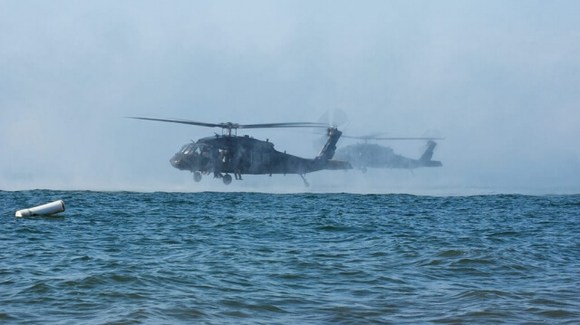 Virginia National Guard flight crews provide aviation support to Soldiers assigned to the West Virginia National Guard’s 19th Special Forces Group, Sept. 5, 2018, over Lake Erie in Hamburg, N.Y., just south of Buffalo. The flight crews, assigned to the Sandston-based 2nd Battalion, 224th Aviation Regiment, 29th Infantry Division, dropped operators into the lake as part of an evaluation and pre-deployment train-up while boats from the Hamburg Water Rescue, Hamburg Police Department, U.S. Coast Guard and Department of Homeland Security worked together to retrieve the troops and return to the dry land. Virginia Army National Guard photo by SFC Terra C. Gatti