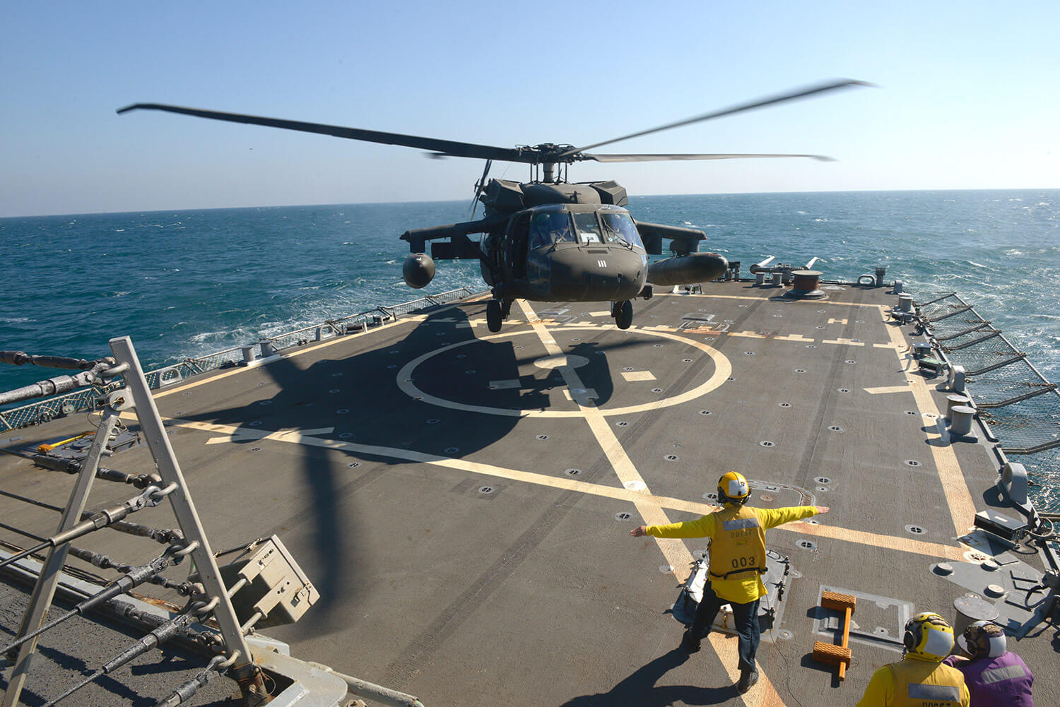 Aviators with the Minnesota, Texas and Utah National Guards, led by the Kansas National Guard’s 1st Battalion, 108th Aviation Regiment, practice landing and taking off during deck landing qualification training aboard the Arleigh Burke-class guided-missile destroyer USS Mitscher (DDG 57) in the Arabian Gulf, February 2019. Minnesota Army National Guard photo by SFC Ben Houtkooper