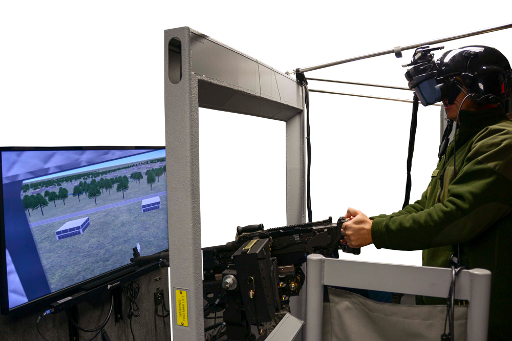 A visiting dignitary participates in a demonstration of a simulator at the National Guard’s Eastern Army National Guard Aviation Training Site. Pennsylvania Army National Guard photo by SGT Zane Craig