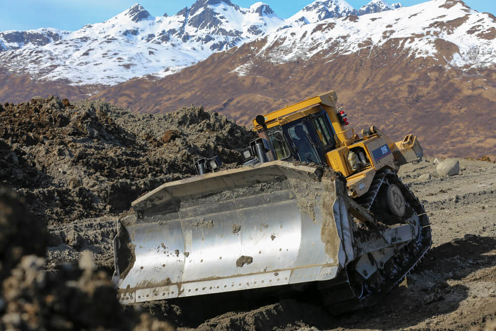 Alaska Army National Guard Soldier SGT Stephen McDowell, horizontal equipment supervisor with the 207th Engineer Utility Detachment, operates a D9R dozer during a runway extension project at Innovative Readiness Training in Old Harbor, Alaska, April 2017. Alaska Army National Guard photo by SSG Balinda O’Neal Dresel