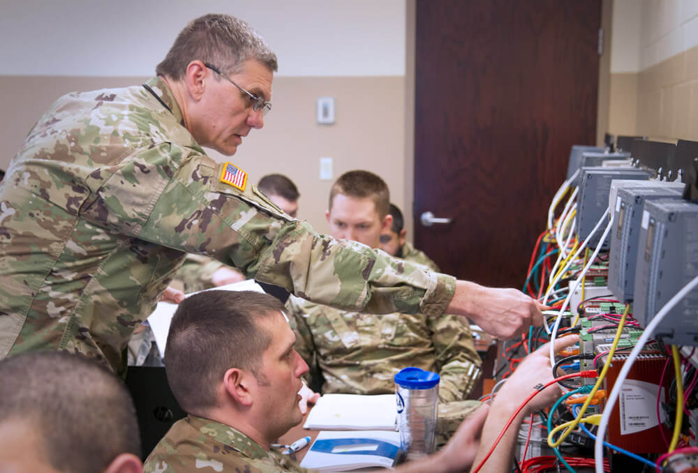 Florida Army National Guard Soldier CW3 Jim Tournade (left), works alongside Oregon Army National Guard Soldier SSG Jason Adsit during a practical exercise as part of Cyber Shield 19. Illinois Army National Guard photo by SPC William Phelps