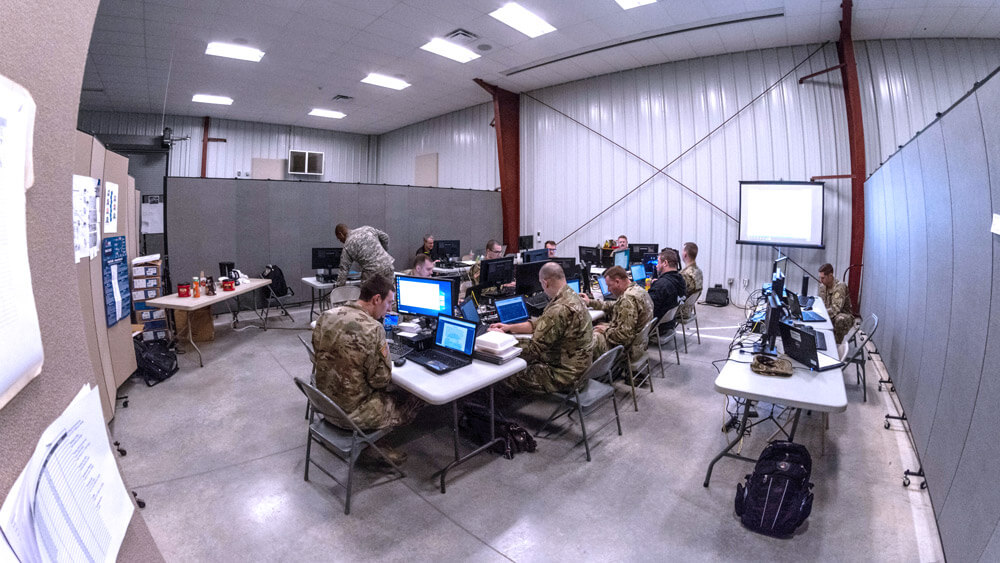 Members of the Kentucky National Guard complete scenario-based exercises in their “cell” during Cyber Shield 19 held at Camp Atterbury, Ind., April 2019. Illinois Army National Guard photo by SGT Stephen Gifford