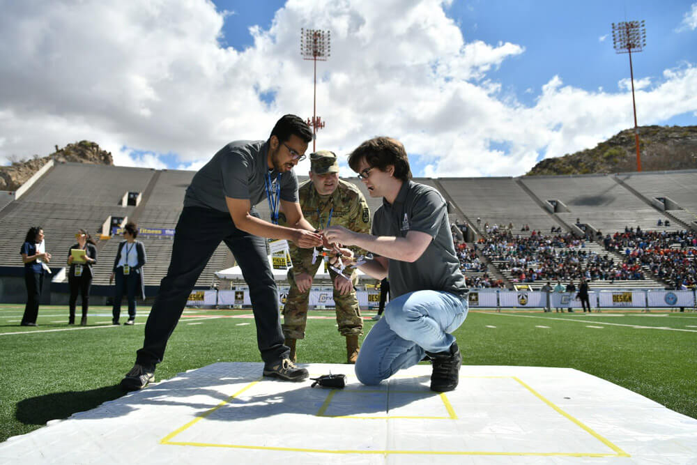 SFC Daniel Guenther observes students from the University of Texas at Arlington as they prepare their unmanned aerial vehicle for a flight demonstration as part of the U.S. Army’s inaugural HBCU/MI Design Competition held at the University of Texas at El Paso’s Sun Bowl Stadium, April 2019.