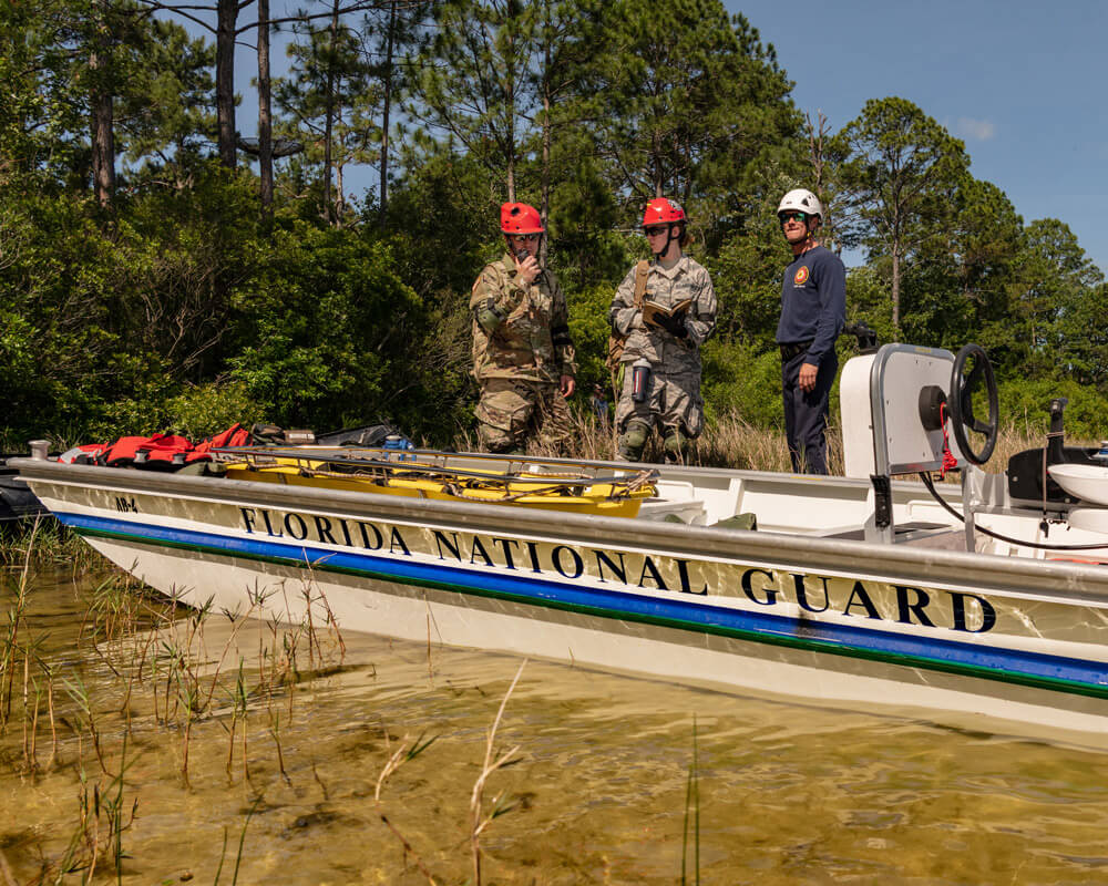 A task force team comprised of Florida Army National Guard Soldiers and Florida civilian first responders rehearse a maritime rescue at Kingsley Lake on Camp Blanding Joint Training Center as part of the annual Search and Rescue Exercise. Florida National Guard photo by Ching Oettel