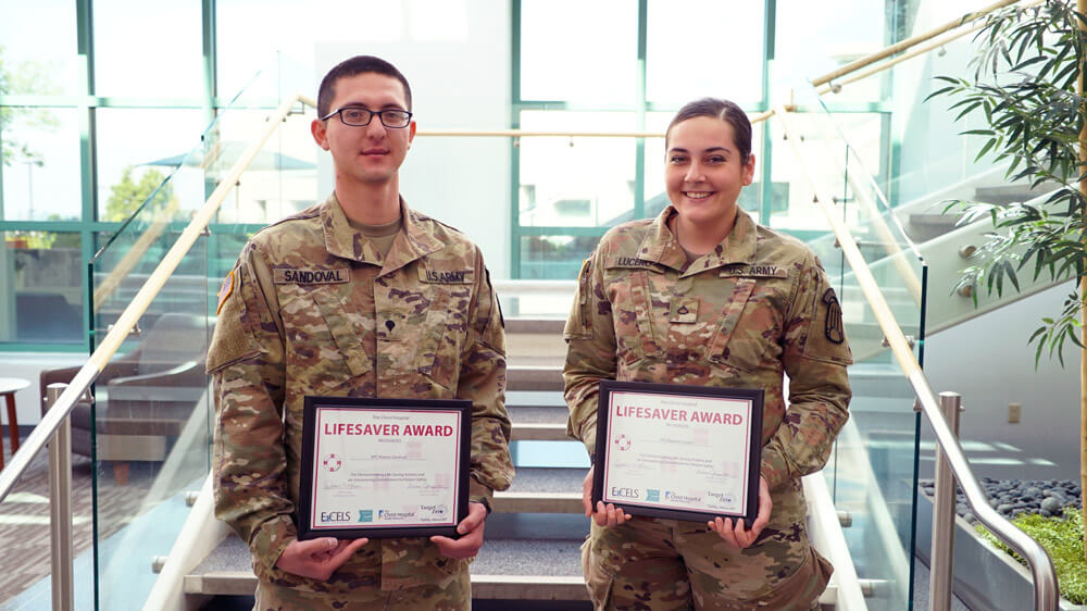 SPC Roberto Sandoval (left) and PFC RaeJean Lucero, both Combat Medics assigned to the 1209th Area Support Medical Company, display their certificates of appreciation presented to them by The Christ Hospital in Cincinnati, Ohio, May 16, 2019, for saving the life of a man seriously injured in a car accident that occurred while the Soldiers were participating in a training class in conjunction with the hospital. Photo courtesy The Christ Hospital