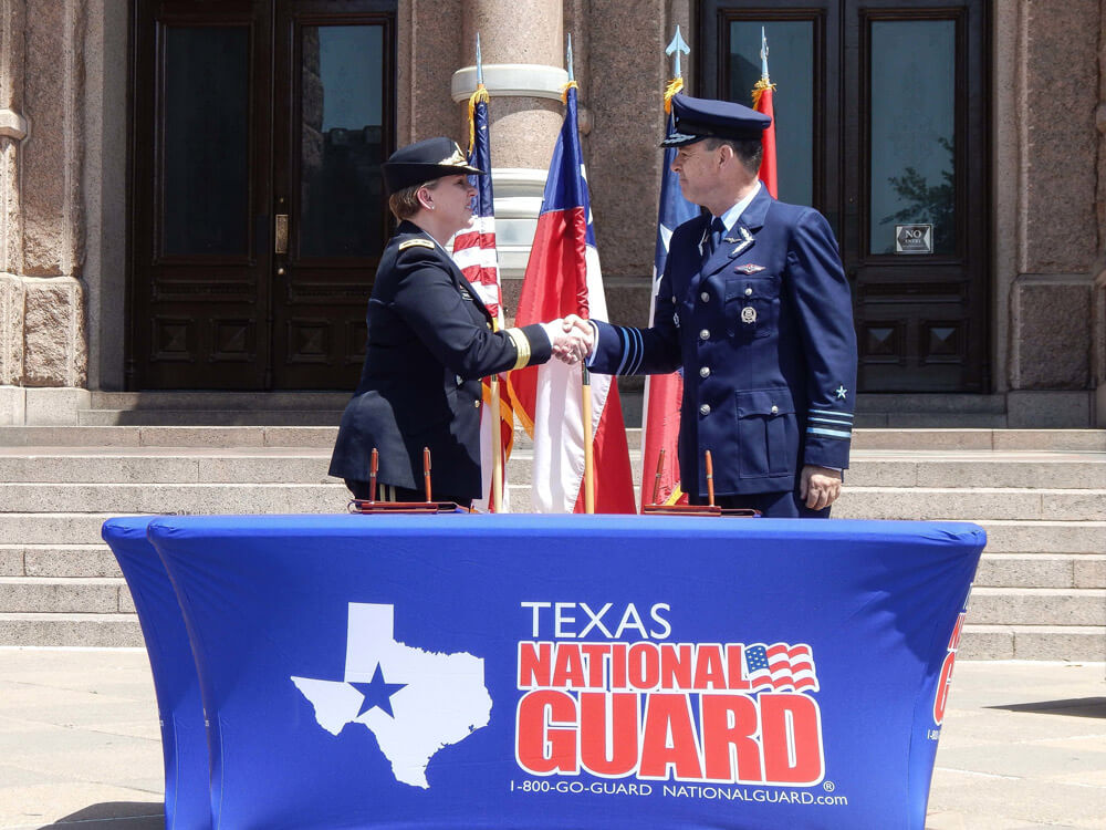Adjutant General of Texas MG Tracy Norris shakes hands with a Chilean military official at the Texas State Capitol in Austin, Texas, April 12, 2019, during a celebration of the ongoing State partnership between Chile and Texas. Texas National Guard photo by Brandon Jones