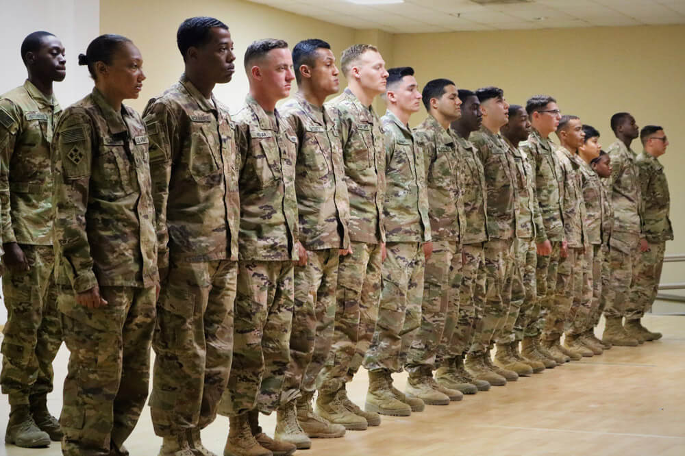 Sixteen Army National Guard Soldiers of the 247th Quartermaster Company each receive a certificate of achievement for going above and beyond during an awards ceremony at Camp Arifjan, Kuwait, April 2019. Army National Guard photo by SGT Roger Jackson